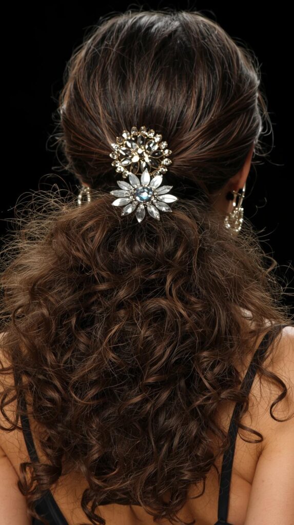 9. Curly Low Ponytail with Statement Accessories